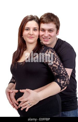 L'amour heureux couple, femme enceinte avec son mari, isolé sur fond blanc Banque D'Images