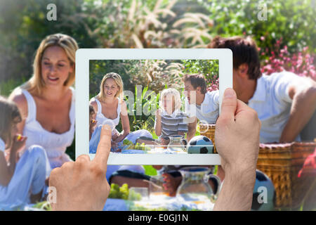 Image composite de hand holding tablet pc Banque D'Images