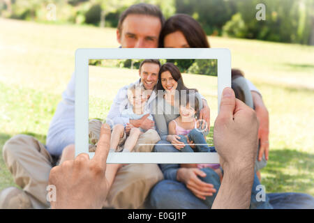 Image composite de hand holding tablet pc Banque D'Images