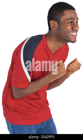 Heureux fan de football en rouge cheering Banque D'Images