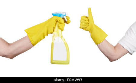 Avec le produit de nettoyage à la main jaune gant showing thumb up. Le nettoyage est fait Banque D'Images