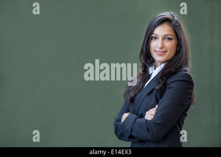 Mixed Race businesswoman smiling Banque D'Images