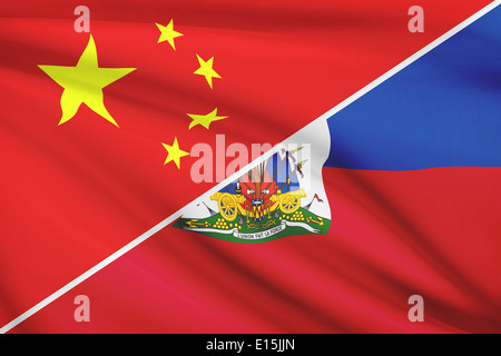 Drapeaux de la Chine et la République d'Haïti dans le vent. Partie d'une série. Banque D'Images