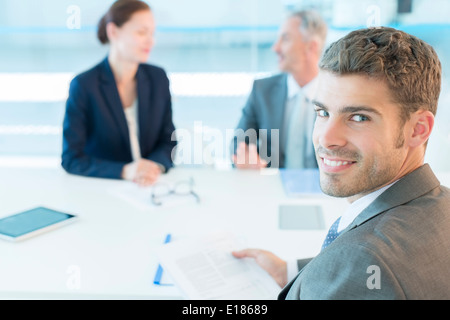 Portrait of smiling businessman in conference room Banque D'Images