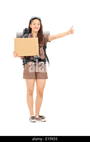 Portrait d'une femme auto-stoppeur holding a blank sign carton Banque D'Images