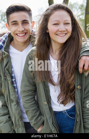 Portrait of teenage couple in parka jackets Banque D'Images