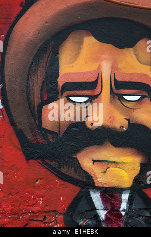 Art urbain représentant un homme avec un chapeau mexicain et la moustache dans la ville coloniale espagnole de Santiago de Queretaro, Mexique Banque D'Images