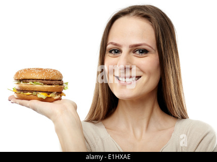 Young attractive caucasian woman holding a hamburger, isolated on white Banque D'Images