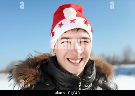 Jeune homme in Santa Hat Banque D'Images