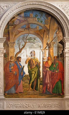 Venise - Saint Jean le Baptiste et les saints par Cima da Conegliano (1495) à l'église Santa Maria dell'Orto. Banque D'Images