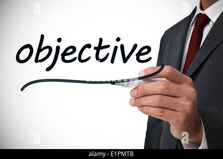 Businessman writing the word objectif Banque D'Images