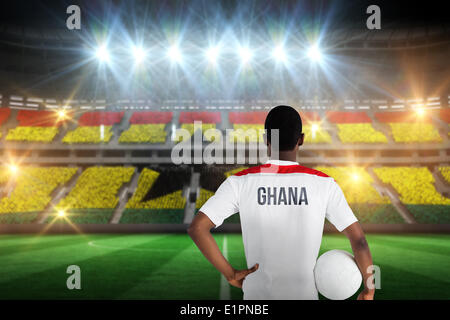 Image composite du Ghana football player holding ball Banque D'Images