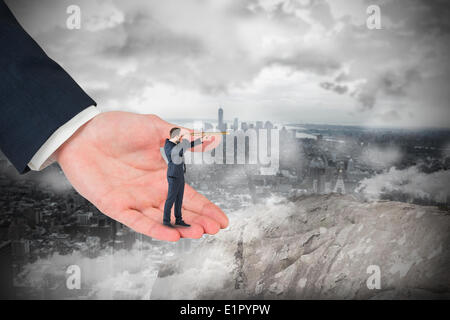 Image composite de businessman looking through telescope en grande part Banque D'Images