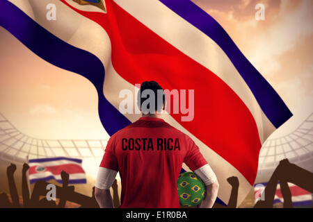 Image composite du costa rica football player holding ball Banque D'Images