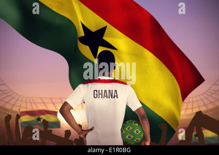 Image composite du Ghana football player holding ball Banque D'Images