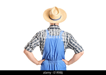 Vue arrière, studio shot d'un agriculteur en jumpsuit Banque D'Images