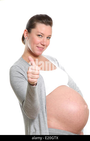 Pregnant woman showing Thumbs up Banque D'Images