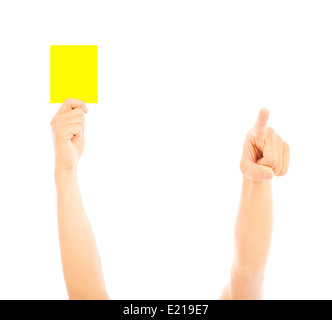 Main de l'arbitre avec carte jaune pour avertir Banque D'Images