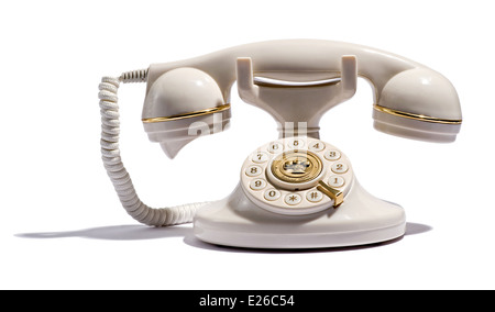 Ancienne rétro téléphone avec un combiné et composez le numéro sur un fond blanc Banque D'Images