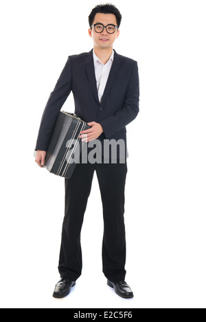 Asian businessman with a suitcase isolated on white Banque D'Images