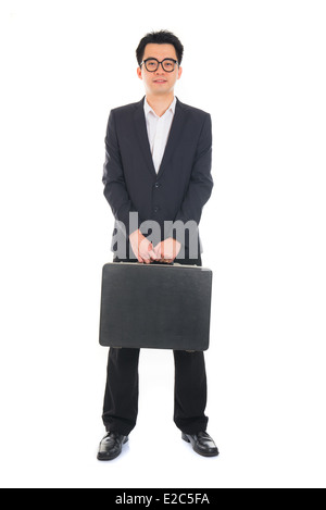 Asian businessman with a suitcase isolated on white Banque D'Images