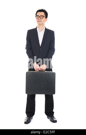 Asian businessman with a suitcase isolated on white Banque D'Images