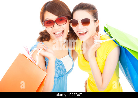 Happy fashion jeunes sœurs with shopping bags Banque D'Images