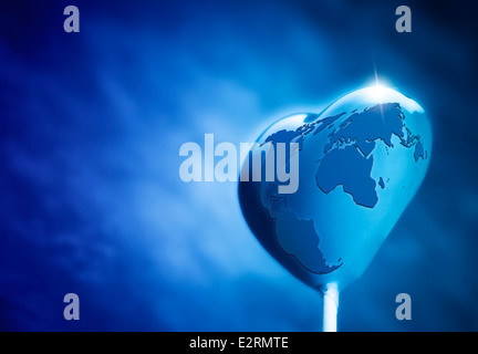 Sucette en forme de coeur sur la terre Banque D'Images