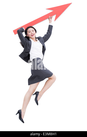 Businesswoman with red arrow sign Banque D'Images