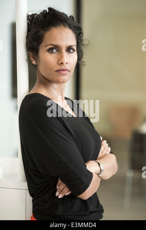 Portrait of confident businesswoman standing in creative office Banque D'Images