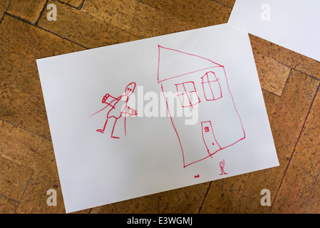 Les jeunes dessin d'enfant au marqueur rouge de la maison et des personnes. Festival culturel de l'enfant, Reykjavik, Islande Banque D'Images