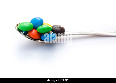 Boutons de chocolat colorés spoon Banque D'Images