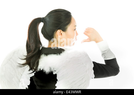 Jolie Asian young adult woman in anges et demon Banque D'Images