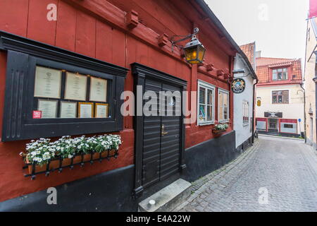 Les chalets et les rues pavées de la ville de Visby, classé au Patrimoine Mondial de l'UNESCO, l'île de Gotland, Suède, Scandinavie, Europe Banque D'Images