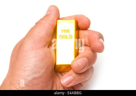 Barre d'or de 200 grammes dans un lingot ou mans hand isolated on a white background studio. Banque D'Images