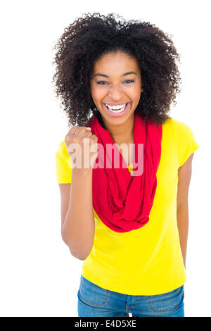 Jolie fille en tshirt jaune et denim short cheering at camera Banque D'Images