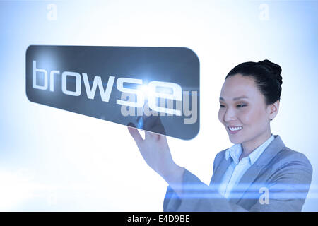 Businesswoman pointing to word parcourir Banque D'Images