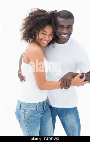 Beau couple de vêtements smiling at camera Banque D'Images