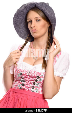 Belle femme dans un allemand traditionnel ou rustique bavarois dirndl et party hat Banque D'Images