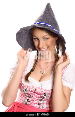 Belle femme dans un allemand traditionnel ou rustique bavarois dirndl et party hat Banque D'Images