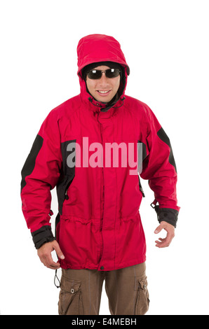 Jeune homme posing wearing red winter coat Banque D'Images