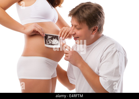 Femme enceinte et mari est holding Ultrasound Banque D'Images