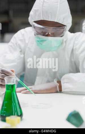 Woman working in protective suit Banque D'Images