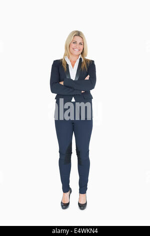Smiling business woman crossing her arms Banque D'Images
