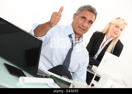 Estate agent with Thumbs up Banque D'Images