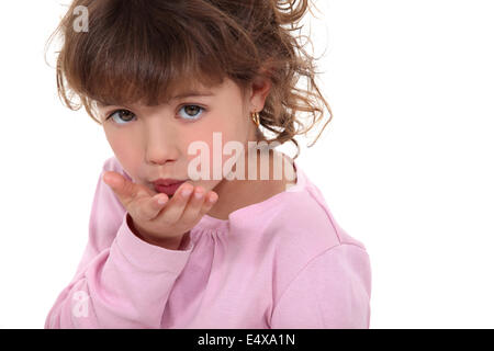 Young Girl blowing a kiss Banque D'Images