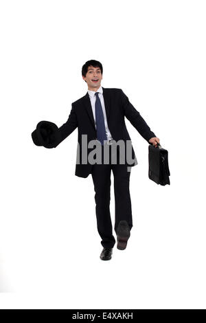 Homme en costume avec chapeau et porte-documents Banque D'Images