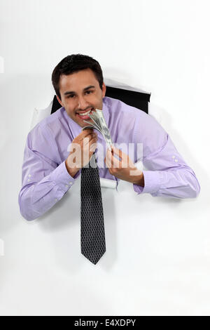 Happy businessman holding beaucoup d'argent Banque D'Images