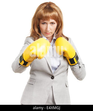 Businesswoman wearing boxing gloves Banque D'Images