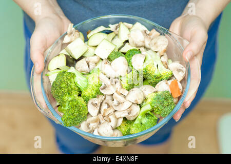 Close up of female holding vegetables Banque D'Images